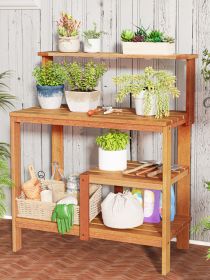 Outdoor wooden potting bench gardening workstation with open shelves for planting, tools, and patio garden storage.