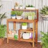 Outdoor wooden potting bench gardening workstation with open shelves for planting, tools, and patio garden storage.