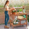 Outdoor wooden potting bench gardening workstation with open shelves for planting, tools, and patio garden storage.