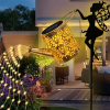 Outdoor solar watering can light, retro metal lantern with hanging LED string lights, waterproof garden decorative solar-powered yard décor.