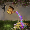 Outdoor solar watering can light, retro metal lantern with hanging LED string lights, waterproof garden decorative solar-powered yard décor.